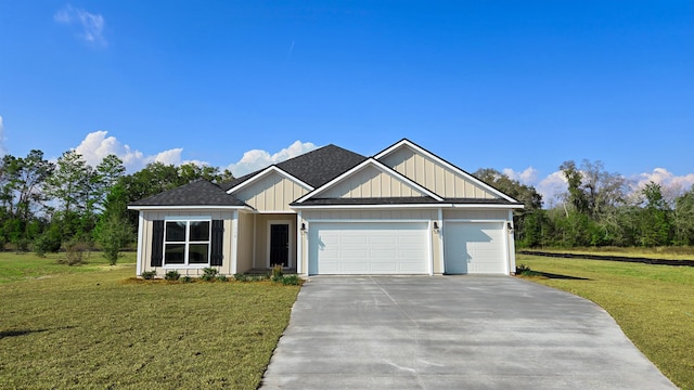 view of front of house featuring a garage and a front lawn