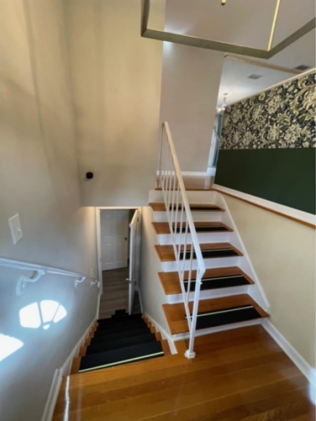 staircase featuring hardwood / wood-style floors