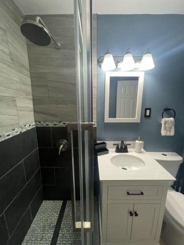 bathroom with vanity and an enclosed shower