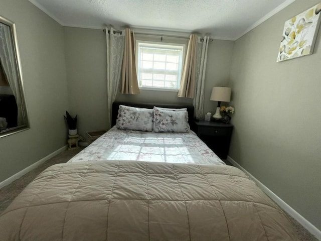 bedroom with a textured ceiling, carpet flooring, and ornamental molding