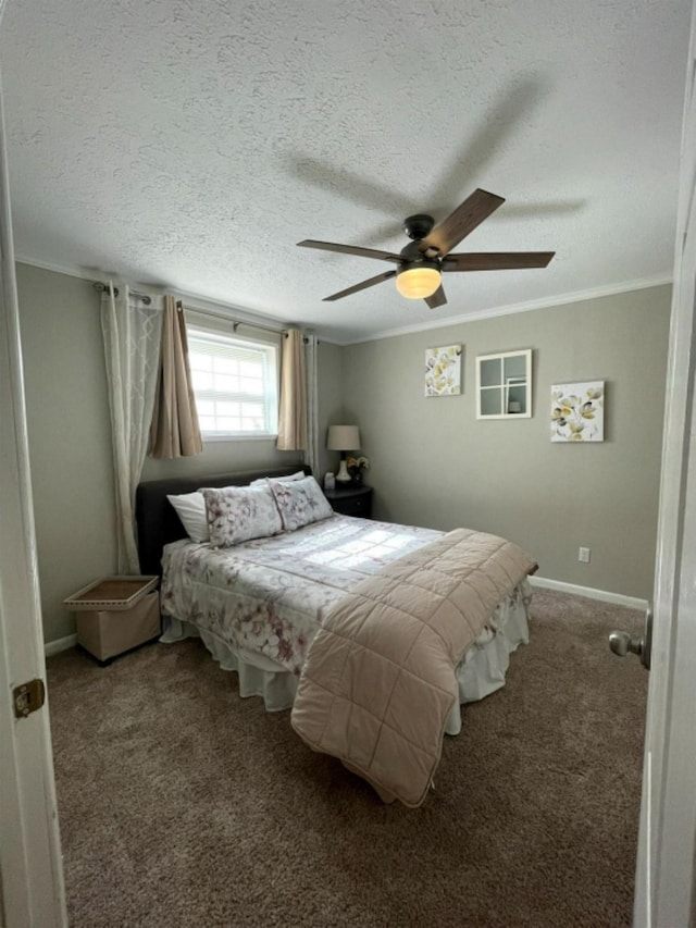 bedroom featuring ornamental molding, carpet, a textured ceiling, and ceiling fan