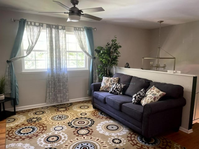 living room with hardwood / wood-style floors and ceiling fan