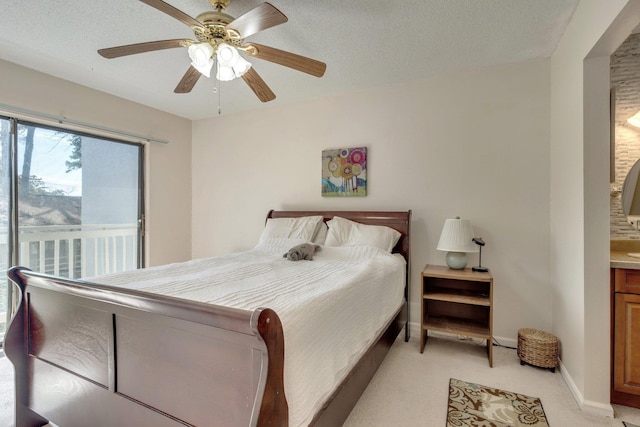 carpeted bedroom featuring ceiling fan, a textured ceiling, and access to outside