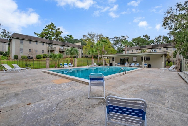 view of swimming pool featuring a patio