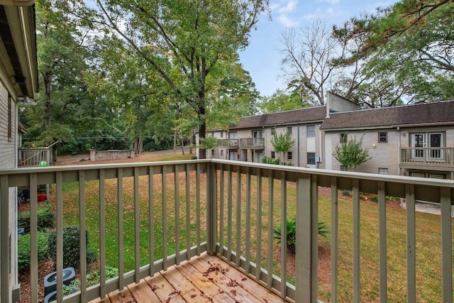 wooden terrace with a yard