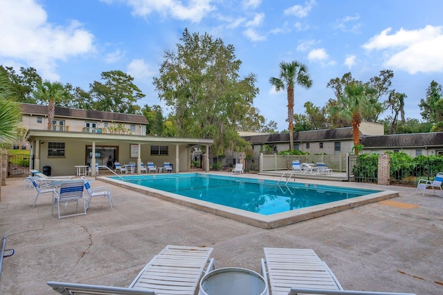 view of swimming pool with a patio