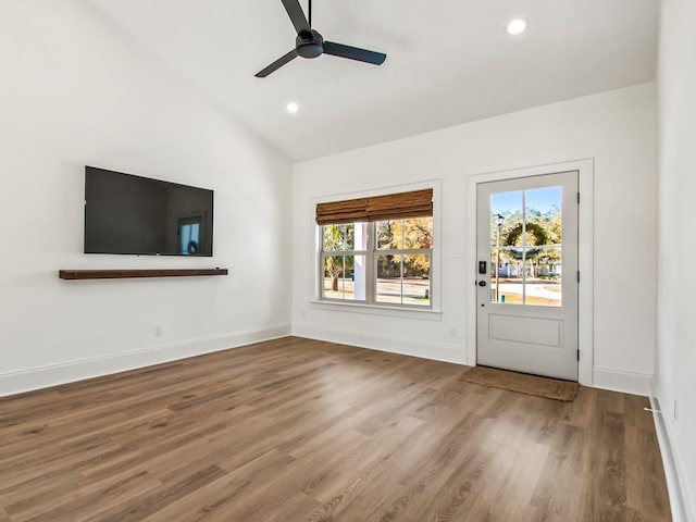 interior space featuring hardwood / wood-style flooring, ceiling fan, and lofted ceiling