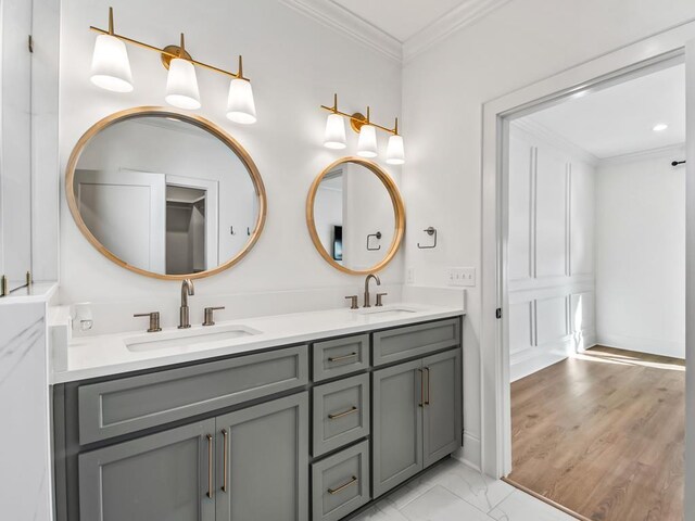 bathroom with crown molding and vanity