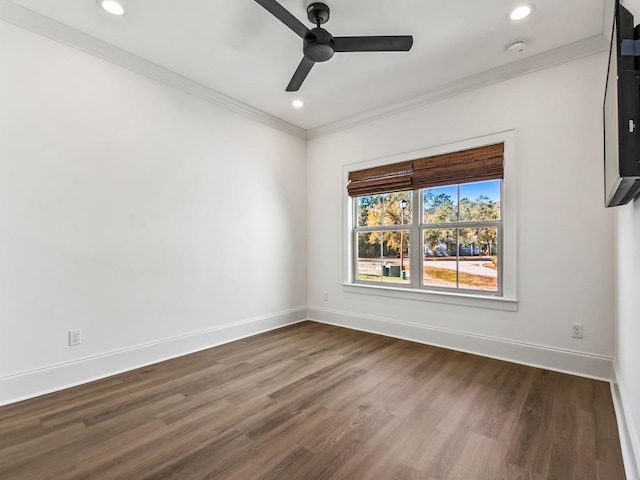 empty room featuring ceiling fan, ornamental molding, and dark hardwood / wood-style flooring