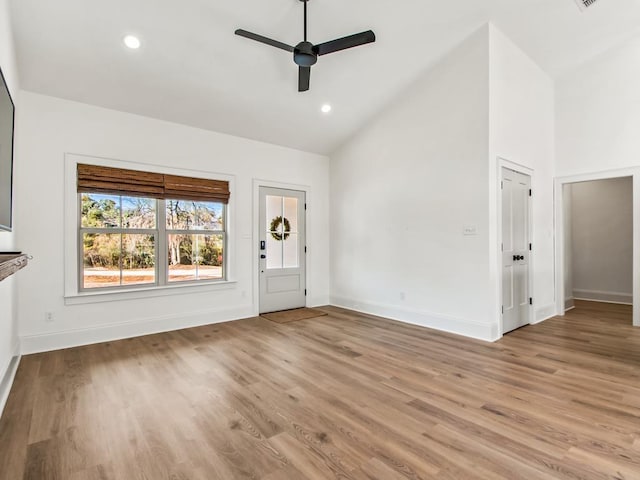 foyer featuring high vaulted ceiling, light hardwood / wood-style flooring, and ceiling fan