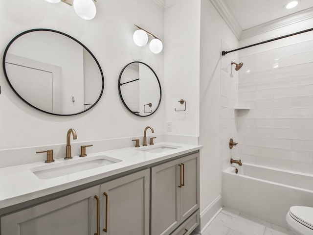 full bathroom featuring toilet, vanity, crown molding, and  shower combination