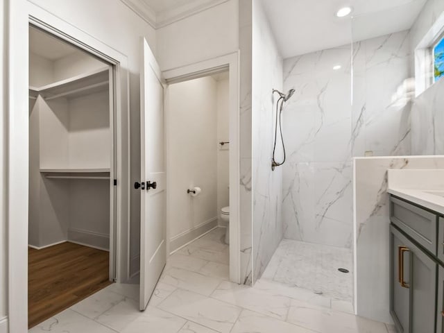 bathroom with vanity, toilet, a shower, and wood-type flooring