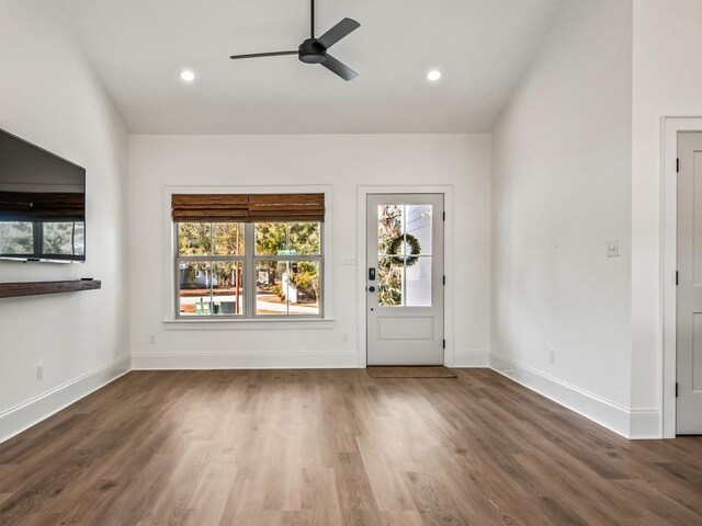 interior space featuring ceiling fan and dark hardwood / wood-style floors