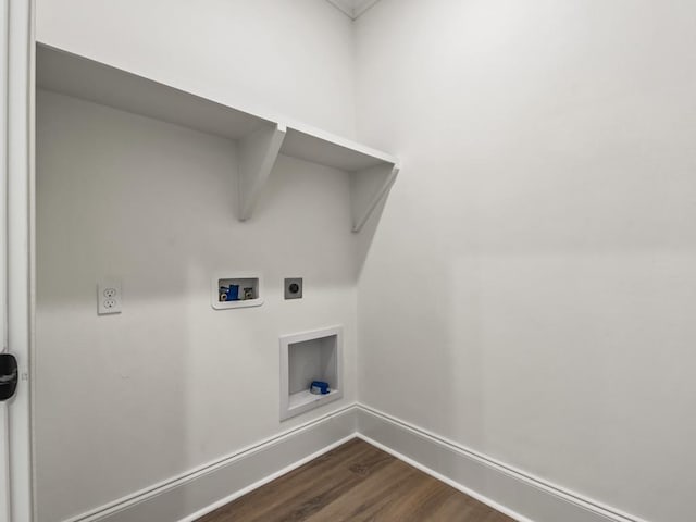 washroom featuring washer hookup, electric dryer hookup, and dark wood-type flooring