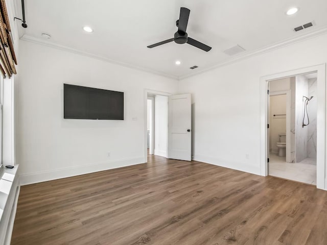 unfurnished bedroom featuring ceiling fan, crown molding, hardwood / wood-style flooring, and ensuite bath