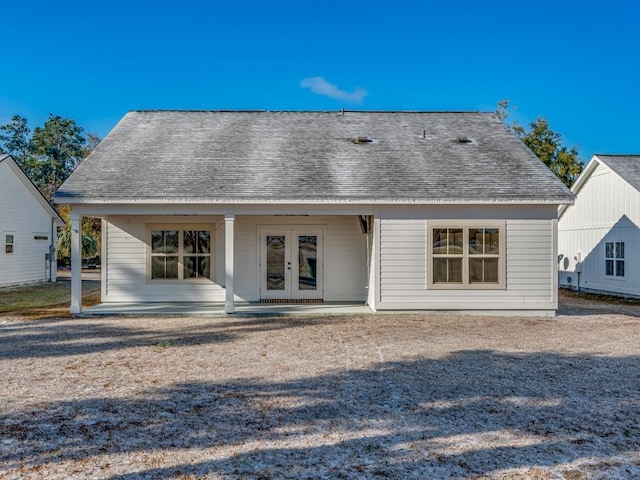 rear view of property featuring a patio and french doors