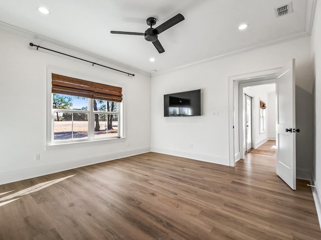 unfurnished living room featuring ceiling fan, ornamental molding, and hardwood / wood-style floors