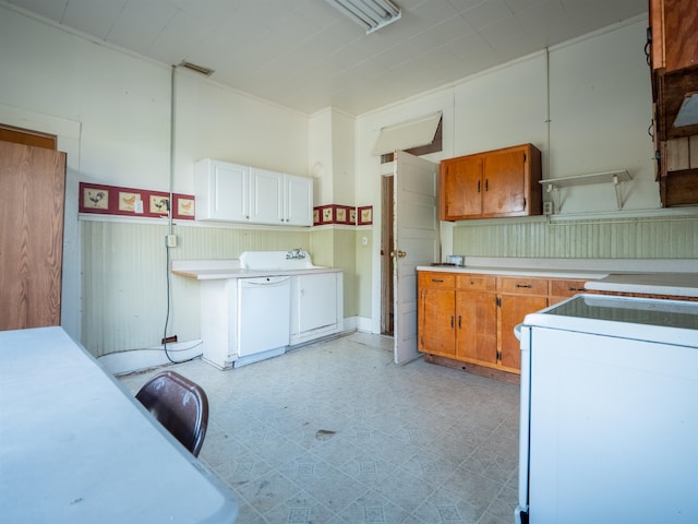 kitchen with stove and white cabinetry