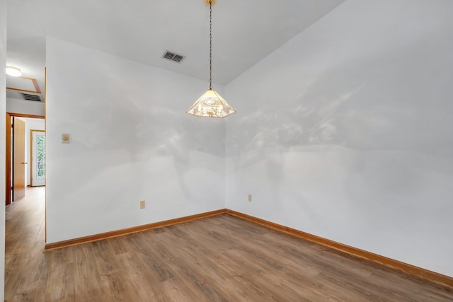 empty room featuring wood-type flooring