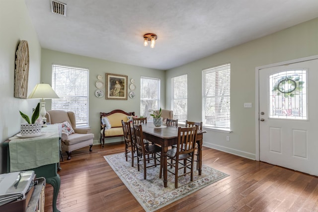 10446 Rose Rd, Tallahassee, FL 32311 - dining area with baseboards, visible vents, and hardwood / wood-style flooring