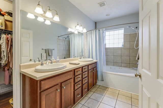 10446 Rose Rd, Tallahassee, FL 32311 - bathroom featuring tile patterned floors, visible vents, a sink, and shower / bathtub combination with curtain
