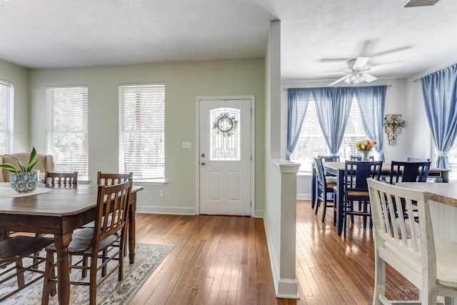 10446 Rose Rd, Tallahassee, FL 32311 - dining area featuring hardwood / wood-style floors, a ceiling fan, and baseboards
