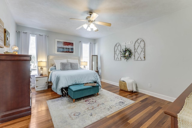 10446 Rose Rd, Tallahassee, FL 32311 - bedroom with baseboards, a ceiling fan, and wood-type flooring