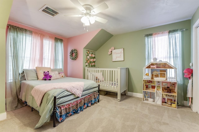 10446 Rose Rd, Tallahassee, FL 32311 - carpeted bedroom featuring vaulted ceiling, multiple windows, ceiling fan, and visible vents