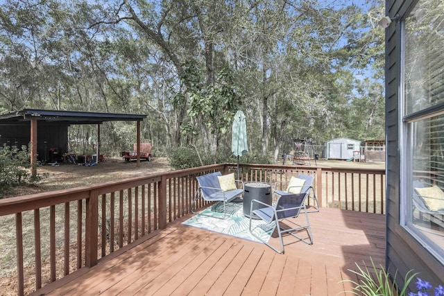 10446 Rose Rd, Tallahassee, FL 32311 - wooden deck featuring a storage shed and an outdoor structure