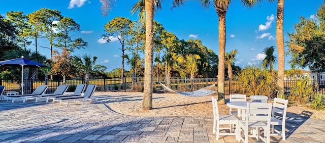 view of property's community with a patio area