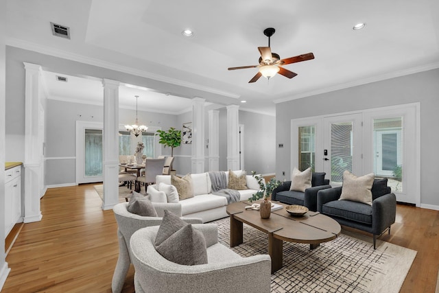 4012 Dutchess Ct, Tallahassee, FL 32309 - living area with decorative columns, light wood-style floors, a chandelier, recessed lighting, and a ceiling fan