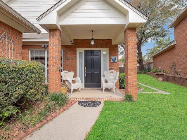 4012 Dutchess Ct, Tallahassee, FL 32309 - doorway to property featuring a lawn, a porch, and brick siding