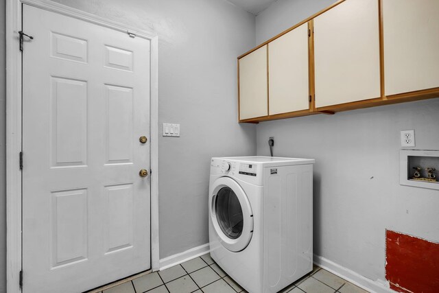 4012 Dutchess Ct, Tallahassee, FL 32309 - laundry room with washer / clothes dryer, cabinet space, and light tile patterned floors