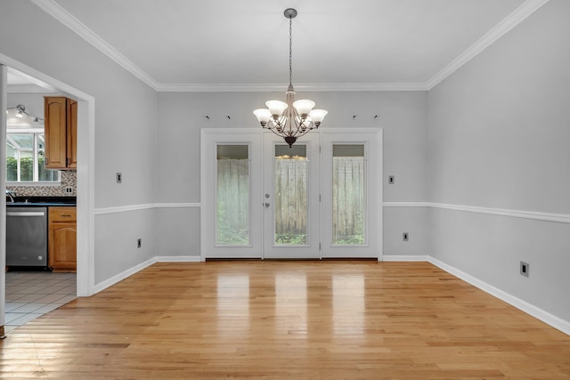 4012 Dutchess Ct, Tallahassee, FL 32309 - unfurnished dining area with a chandelier, light wood finished floors, and crown molding