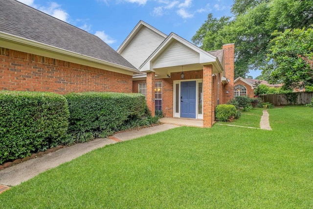 4012 Dutchess Ct, Tallahassee, FL 32309 - view of front of property with a chimney, brick siding, and roof with shingles