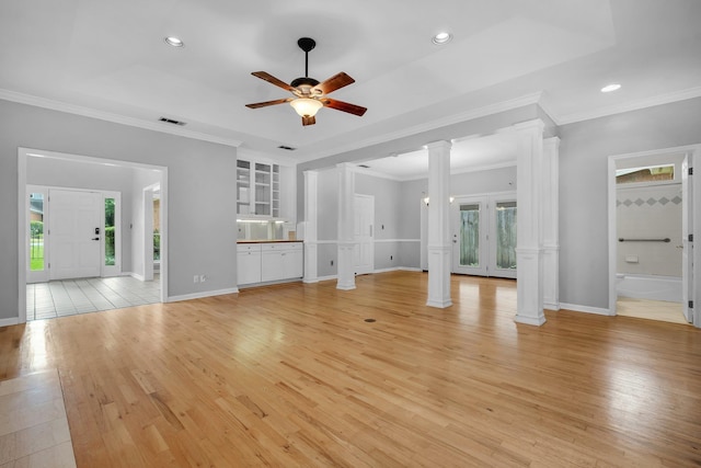4012 Dutchess Ct, Tallahassee, FL 32309 - unfurnished living room featuring decorative columns, ceiling fan, light wood-style flooring, recessed lighting, and ornamental molding