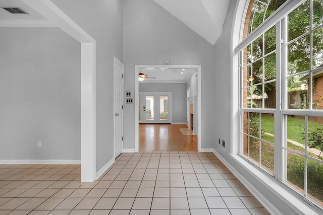 4012 Dutchess Ct, Tallahassee, FL 32309 - foyer with ceiling fan, crown molding, light tile patterned floors, and vaulted ceiling