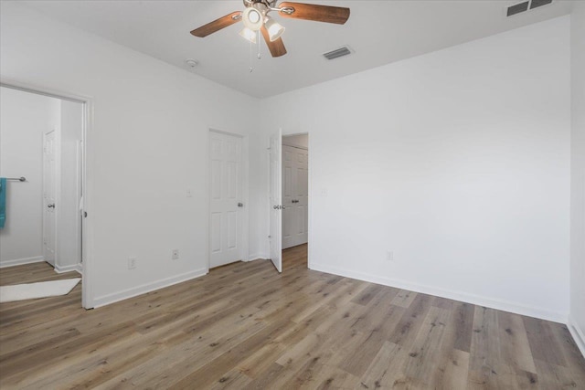 4312 Four Oaks Blvd, Tallahassee, FL 32311 - unfurnished bedroom with light wood-style flooring and ceiling fan