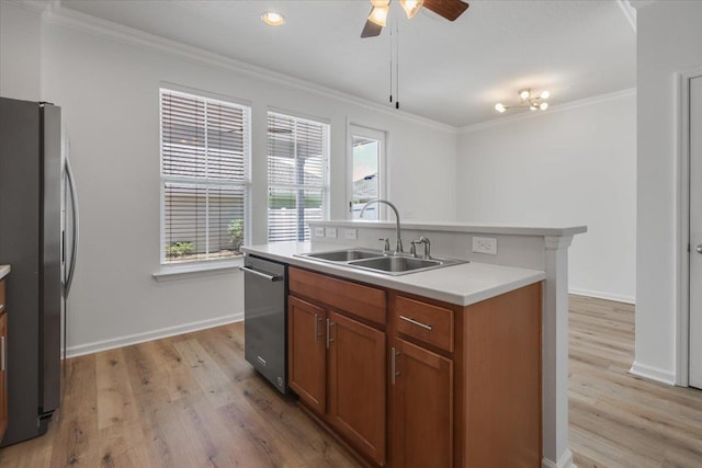 4312 Four Oaks Blvd, Tallahassee, FL 32311 - kitchen with appliances with stainless steel finishes, brown cabinetry, light wood-style floors, a ceiling fan, and ornamental molding