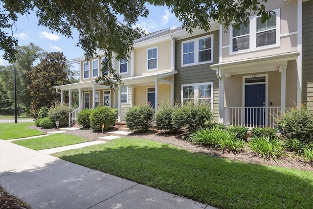 4312 Four Oaks Blvd, Tallahassee, FL 32311 - view of front of house with a front yard and a porch