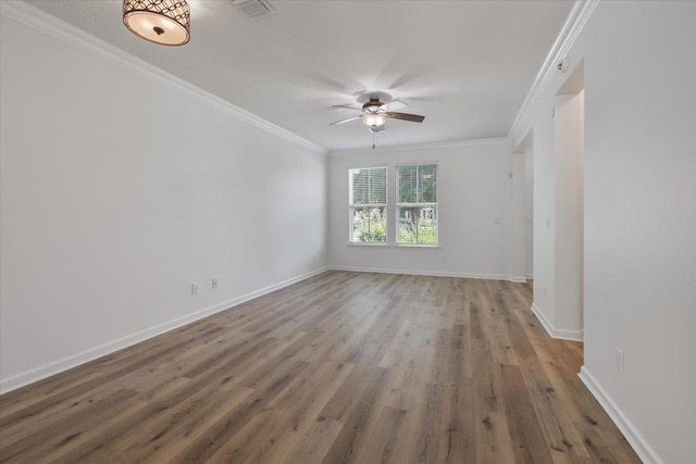 4312 Four Oaks Blvd, Tallahassee, FL 32311 - empty room featuring a ceiling fan, ornamental molding, and wood finished floors