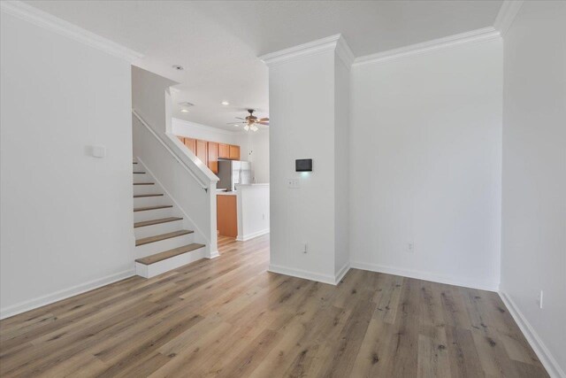 4312 Four Oaks Blvd, Tallahassee, FL 32311 - spare room with ornamental molding, ceiling fan, stairs, light wood finished floors, and recessed lighting