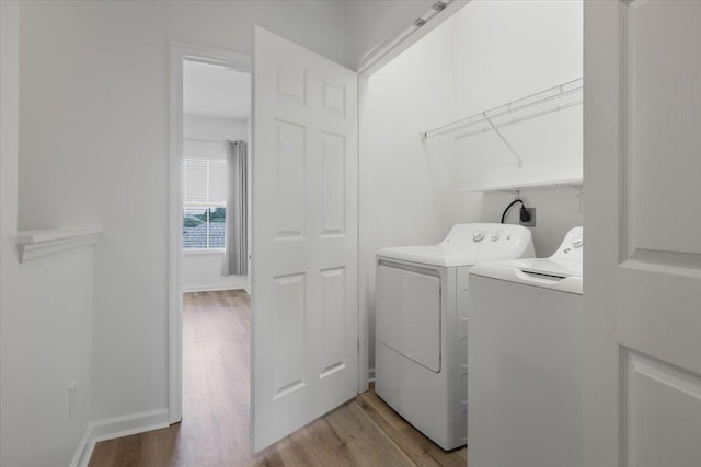 4312 Four Oaks Blvd, Tallahassee, FL 32311 - laundry area with independent washer and dryer and light wood-style flooring