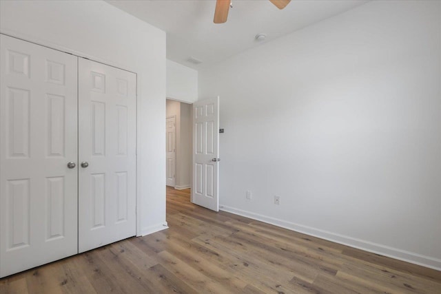 4312 Four Oaks Blvd, Tallahassee, FL 32311 - unfurnished bedroom with wood finished floors, a closet, and ceiling fan