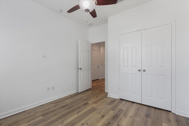 4312 Four Oaks Blvd, Tallahassee, FL 32311 - unfurnished bedroom with wood finished floors, a closet, and ceiling fan