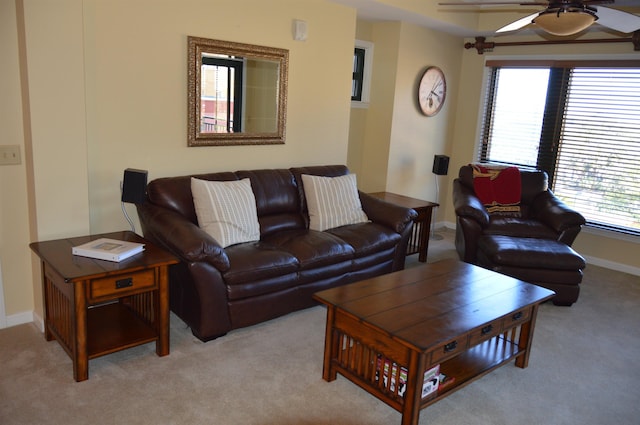 carpeted living room featuring ceiling fan