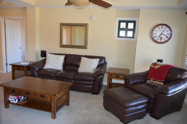 living room with ceiling fan and light carpet