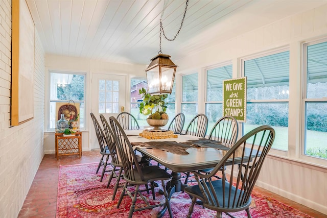 dining area featuring wood ceiling