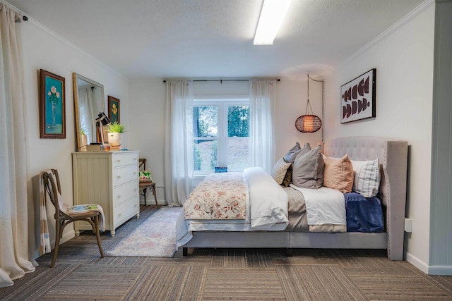 bedroom with dark colored carpet and crown molding