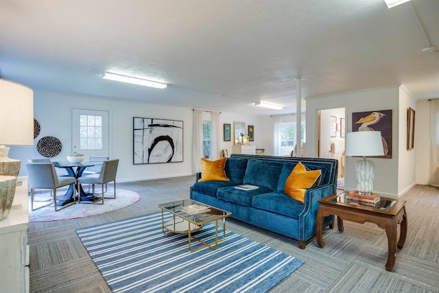 living room featuring plenty of natural light and carpet